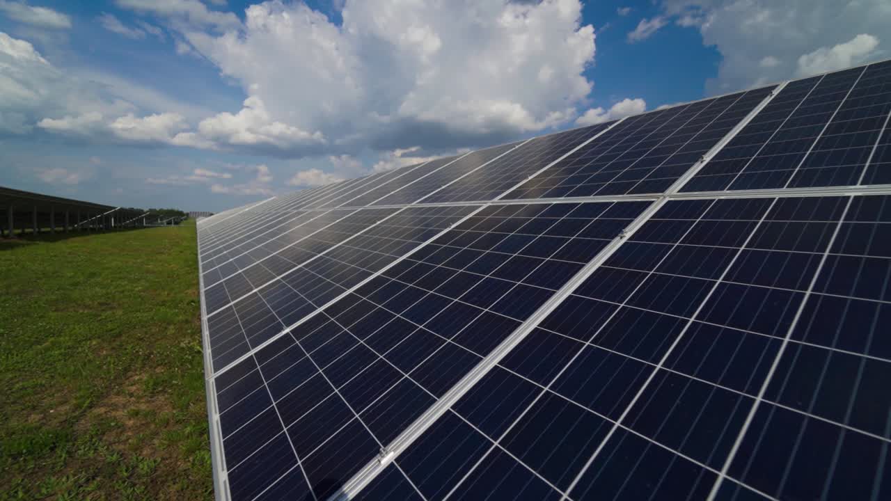 Close-up of solar panel collecting sunlight. Ecology innovation of clean sun energy. Long solar device on the field.