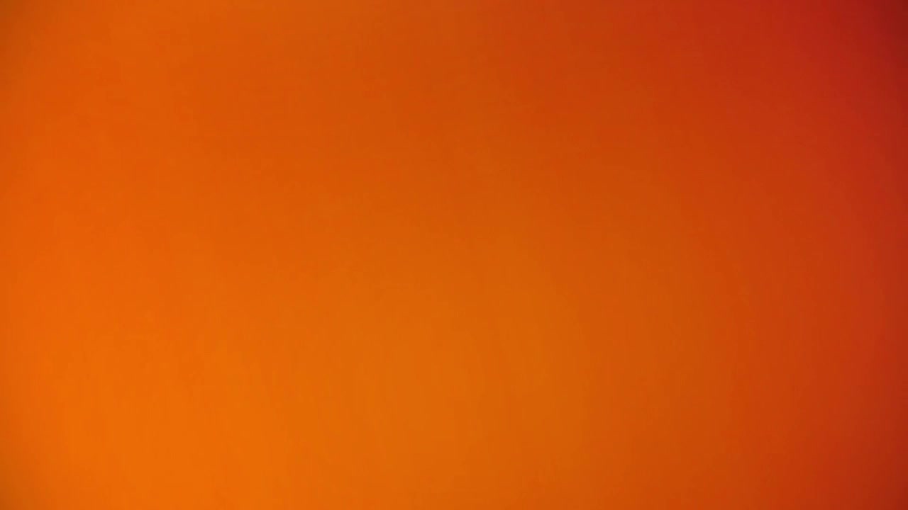 Abstract Light Leak Transition with Warm Orange and Dark Tones