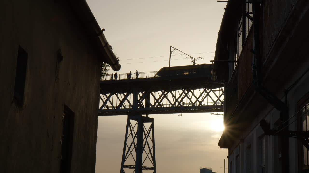 Porto subway passing over the Dom Luis I bridge at sunset. Low angle