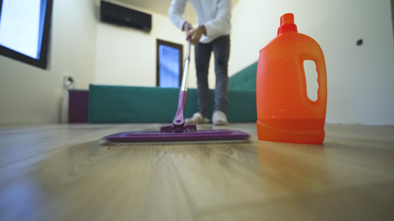 Seasonal spring cleaning concept with POV perspective, focusing on floor mopping, freshness, and home renewal