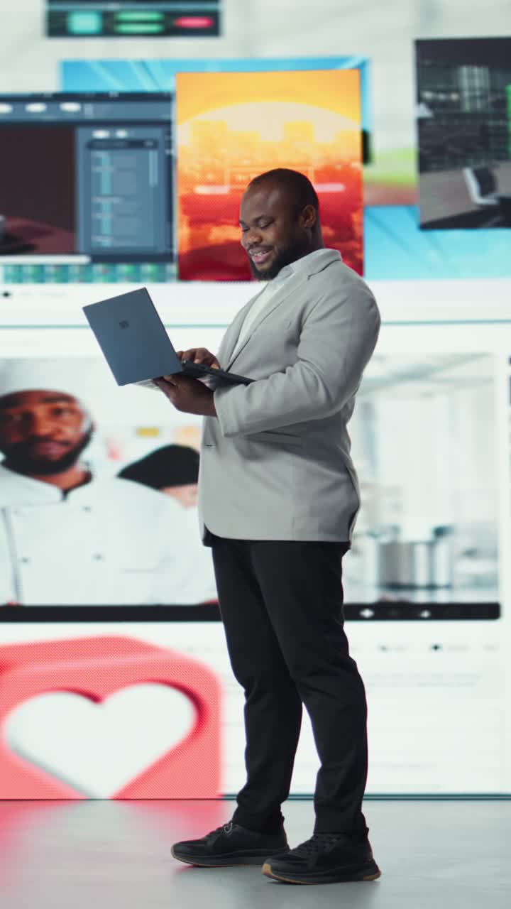 Vertical video Joyful man using streaming services on laptop