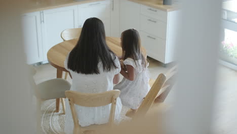 mother and daughter in kitchen