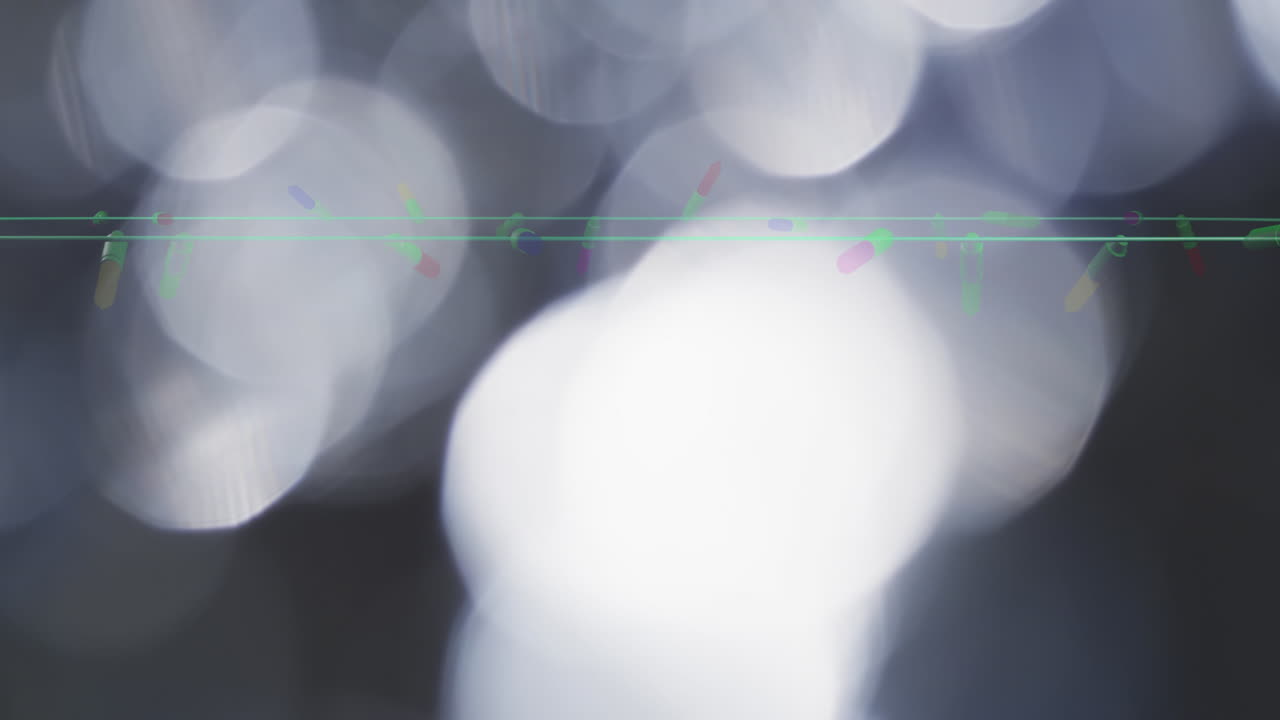 검은 바탕에 빛의 반점에 크리스마스 요정 불빛의 애니메이션