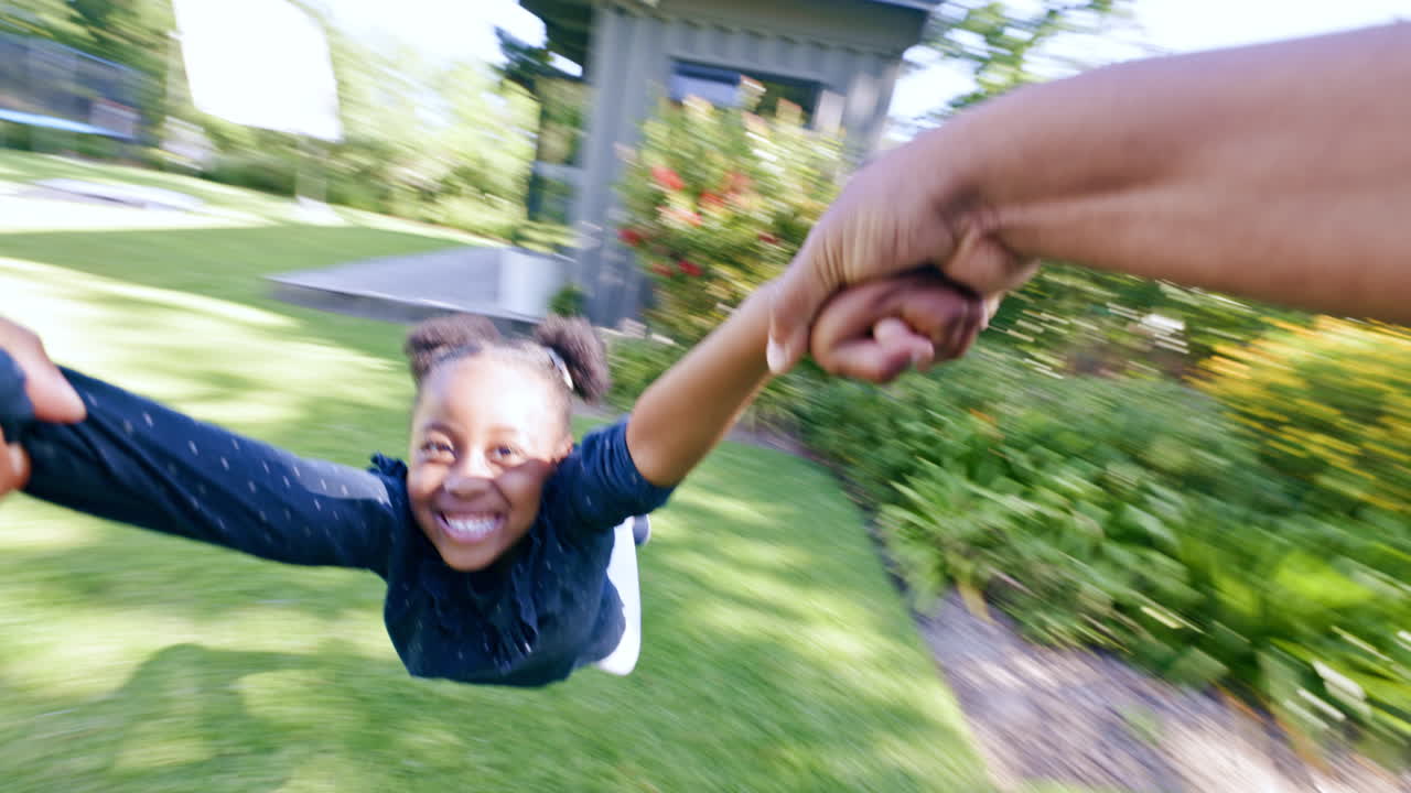 Smile, hands and pov of kid spinning at backyard