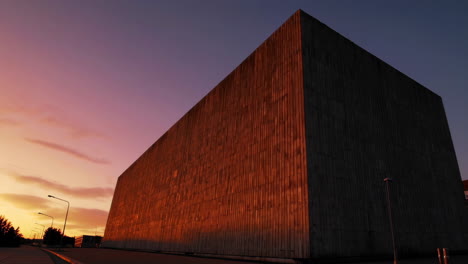 massive concrete building at sunset