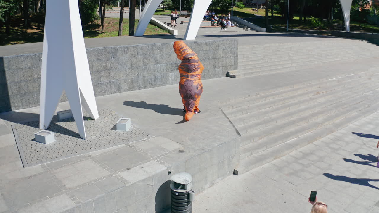 Person in a Dinosaur Costume at a Public Park