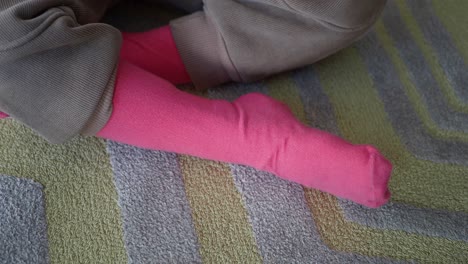 adorable baby girl wearing pink socks