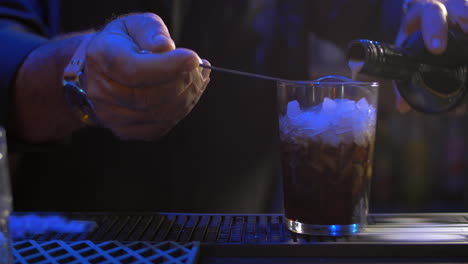 bartender making alcoholic cocktail