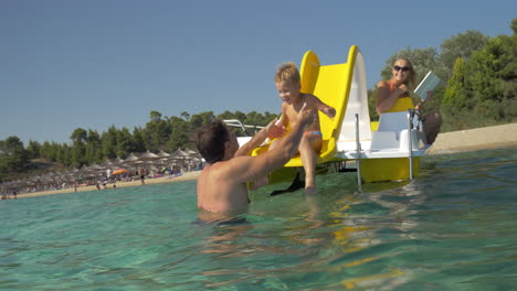 family having fun in water