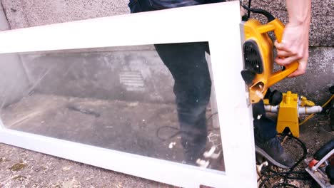 carpenter polishing a wooden frame