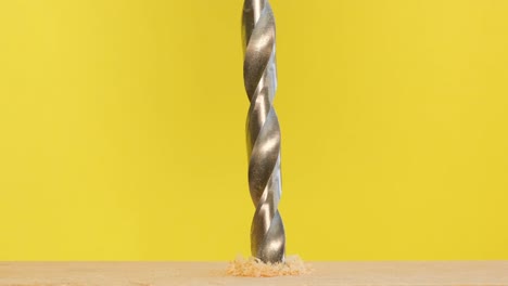 drill bit drilling into wood