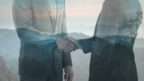 animation eines mittleren teils kaukasischer geschäftsleute, die sich die hände über die landschaft schütteln