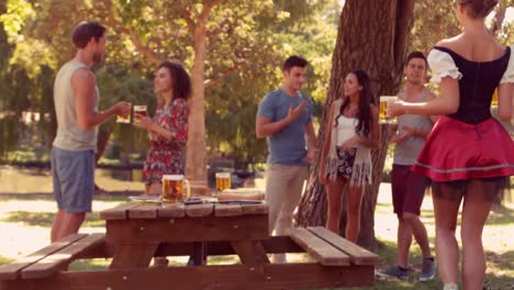 Waitress-bringing-pints-of-beer-in-the-park-