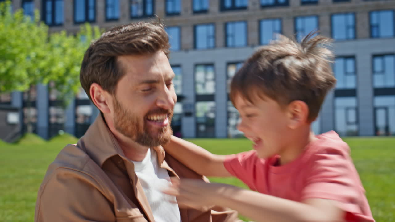 Young parents kid sitting grass summer picnic closeup. Couple child have fun