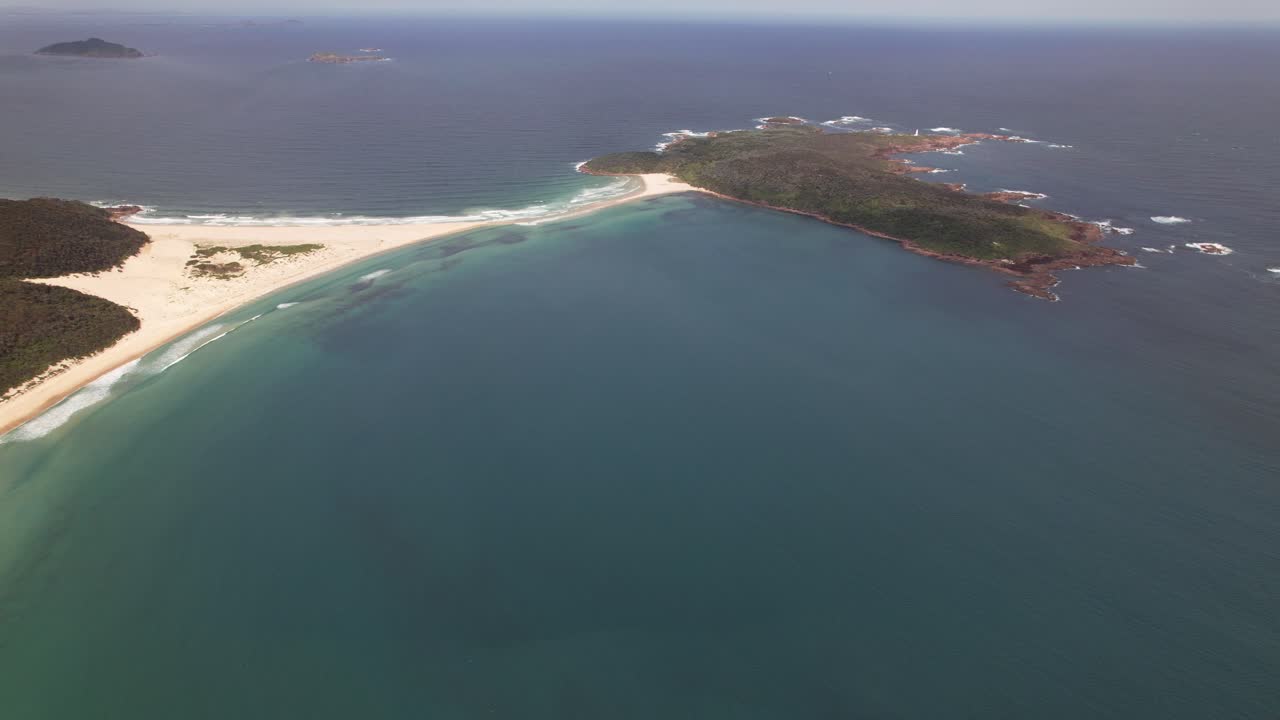 View From Above Of Fingal Beach And Island Surrounded By Turquoise Sea In New South Wales, Australia. aerial shot