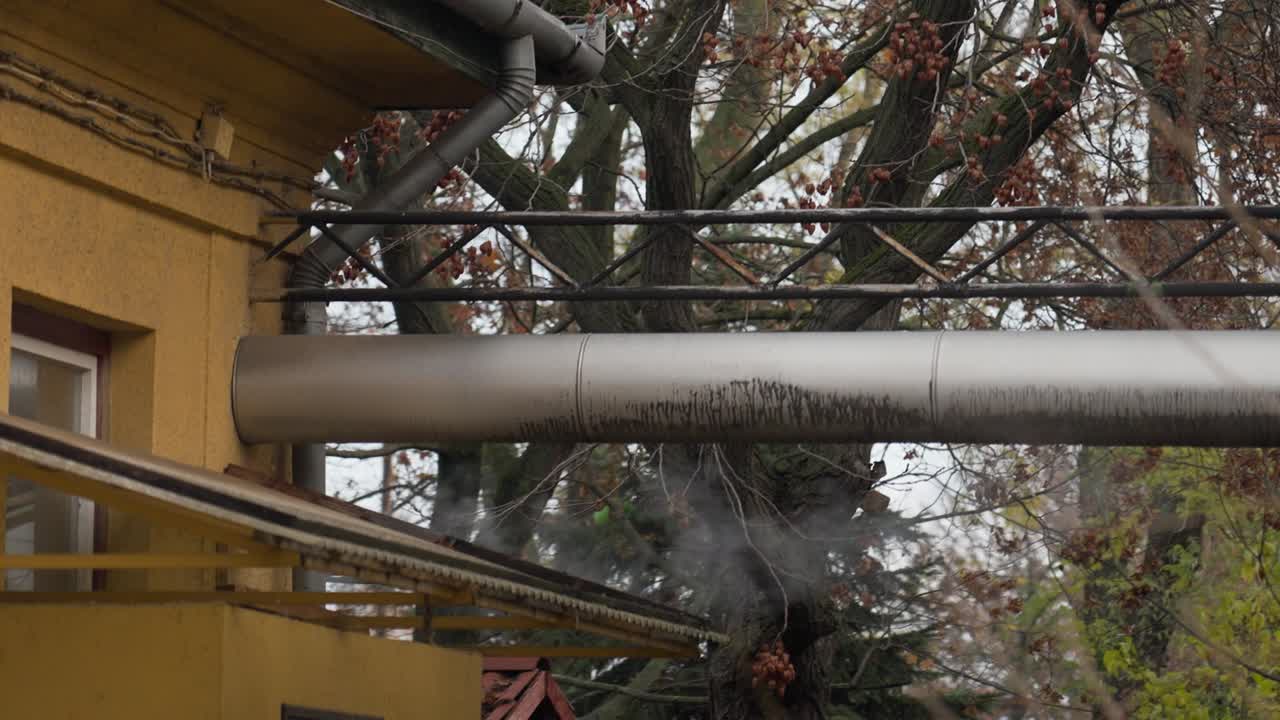 Steam coming out of exterior industrial pipe