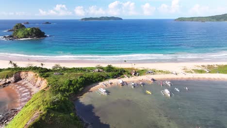 scenic view of white sand nacpan beach and tropical coastal of palawan, philippines. summer