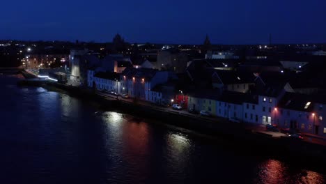 cinematic aerial of the long walk and river corrib at night