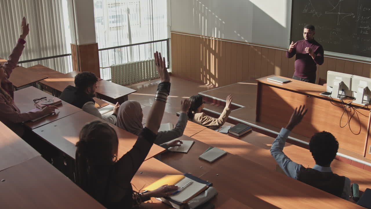 Students Raising Hands to Answer at Maths Lesson