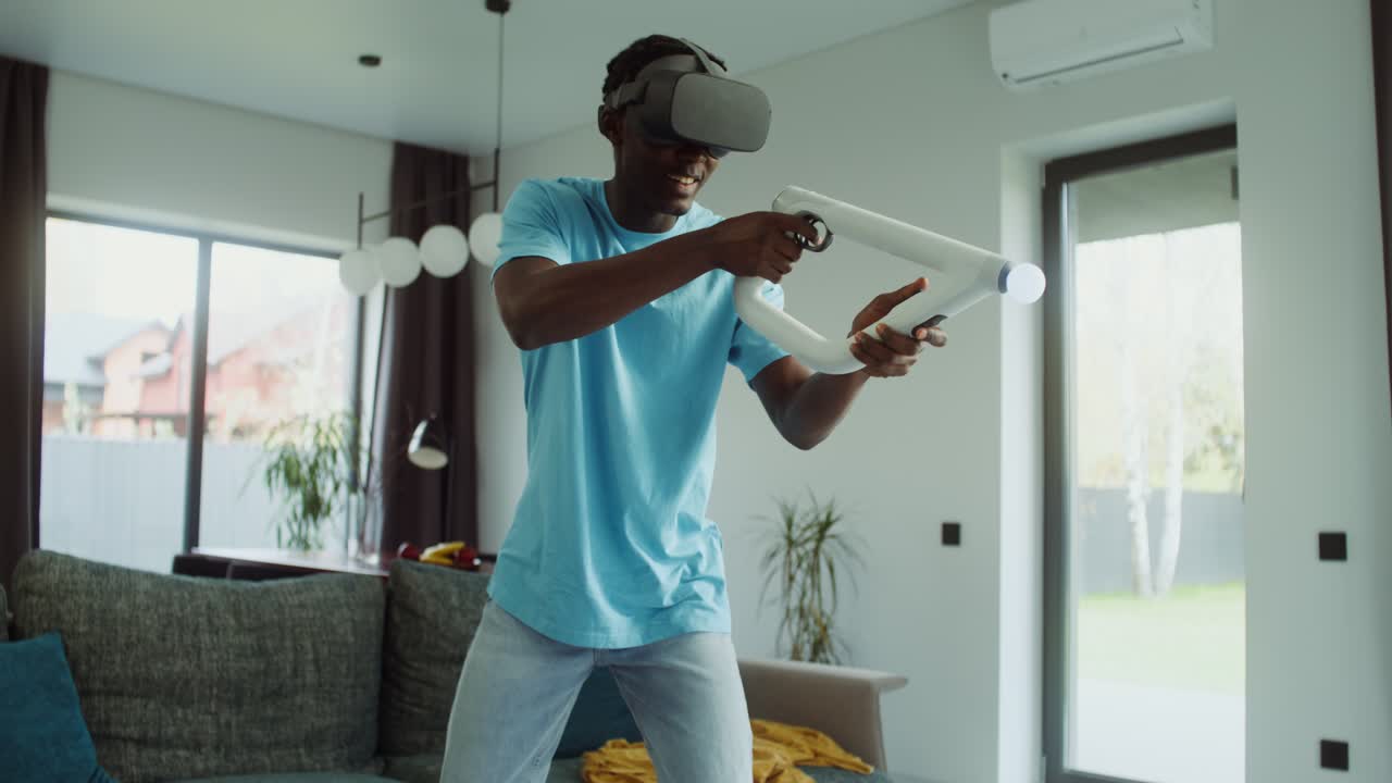 Man playing VR game in living room