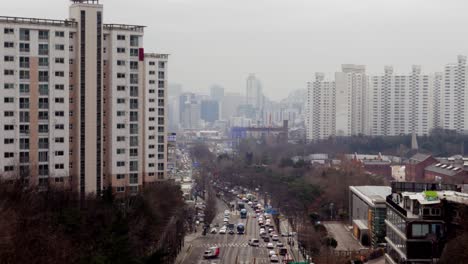 Busy Road and Apartment Buildings on a Misty Afternoon in Seoul, South Korea