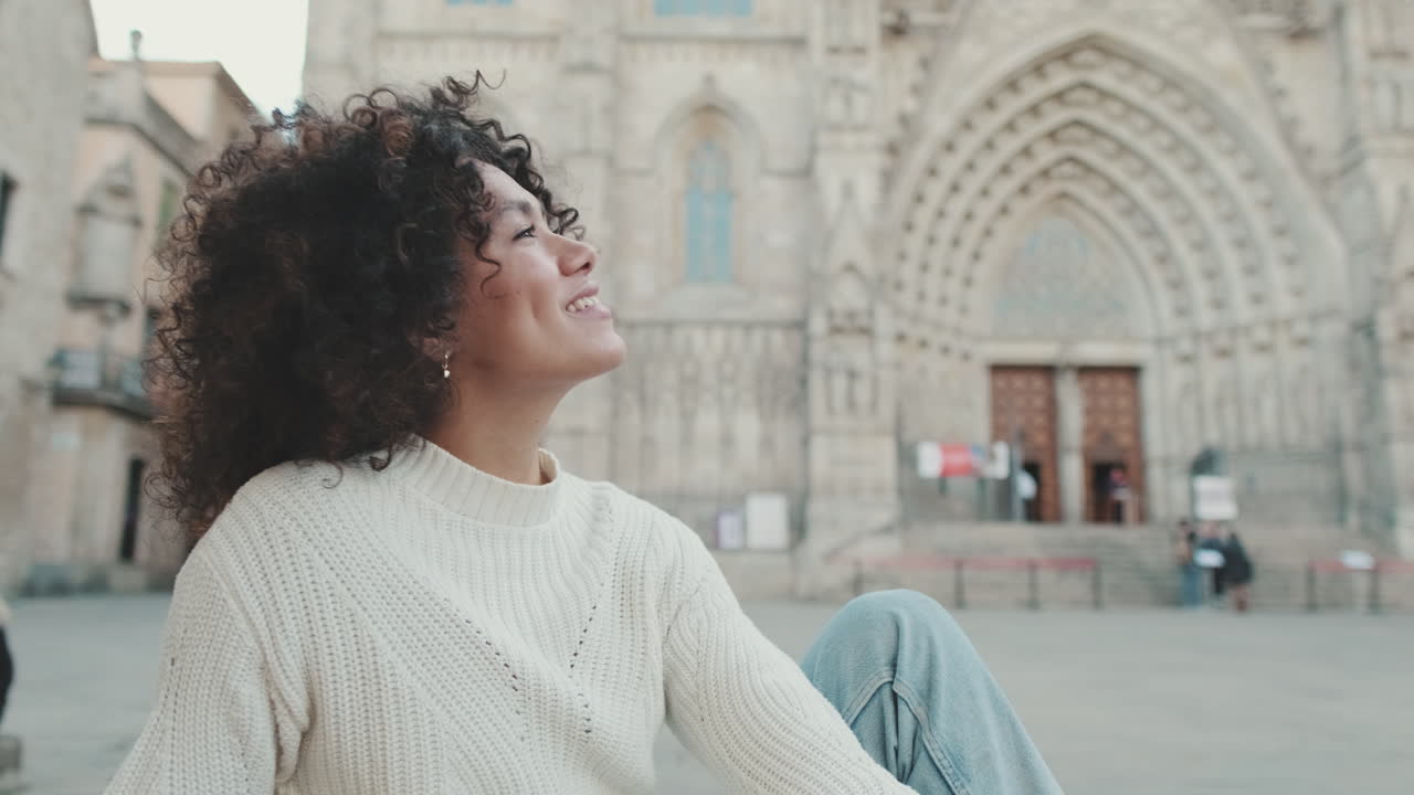 Woman smiling in front of cathedral