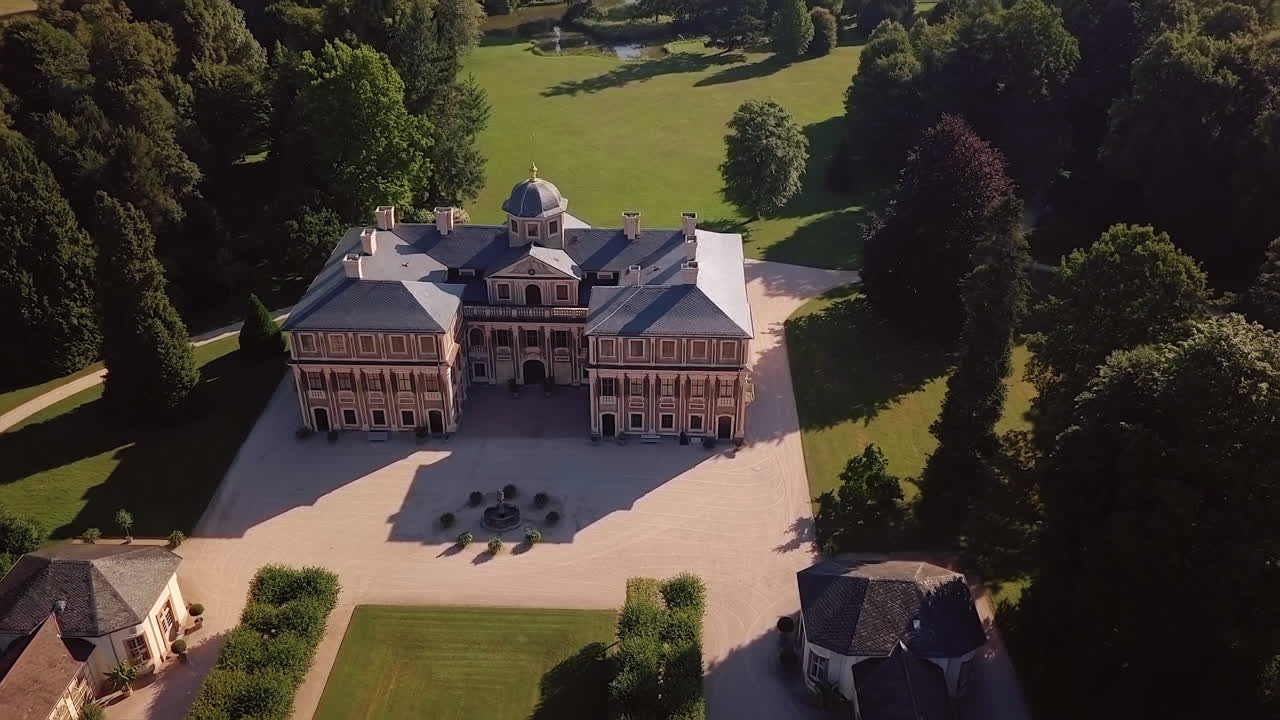 Surrounding aerial view of 'Favorite' castle a Baroque pleasure palace near Rastatt surrounded by lush greenery on a sunny day