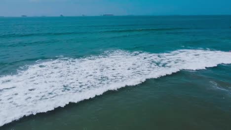 High-and-wide-angle-shot-of-waves-rolling-into-shore