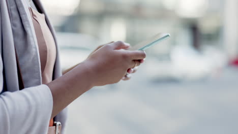 Texting,-phone-and-hands-of-woman-in-city