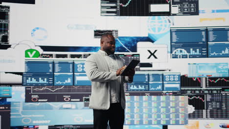 african american businessman in a digital environment focused on graphs
