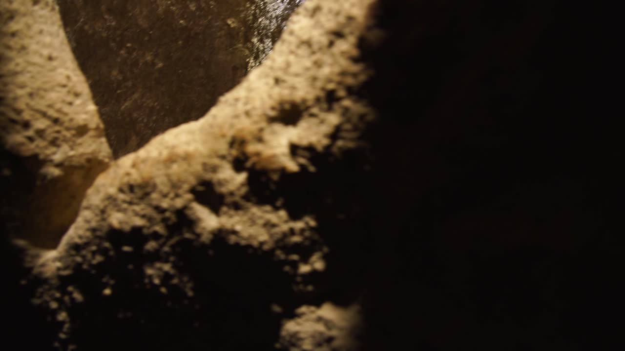 Deep Infinite black void, Ventilation Shaft In Kaymakli Underground City, Derinkuyu, Cappadocia, historic Turkey - revealing dark, deep hole