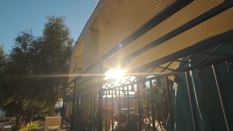 jerusalem village house, revalling flares with a porch, sunset golden hour dolly upshot