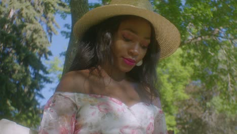 black woman writting smiling face close up