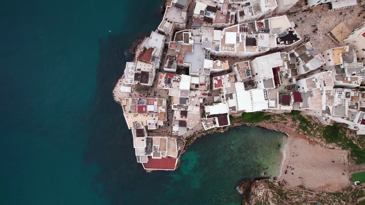 Aerial top down view of Polignano town building on sea coast, Puglia, Italy