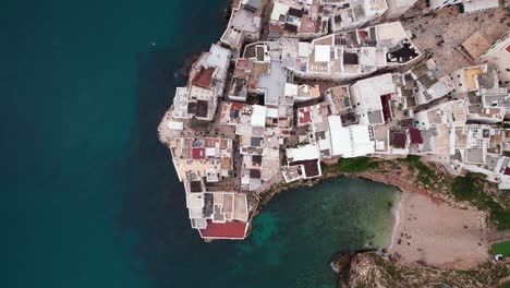 aerial top down view of polignano town building on sea coast, puglia, italy