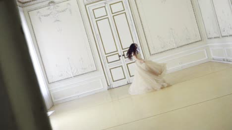 young-brunette-woman-dances-alone-in-long-evening-dress