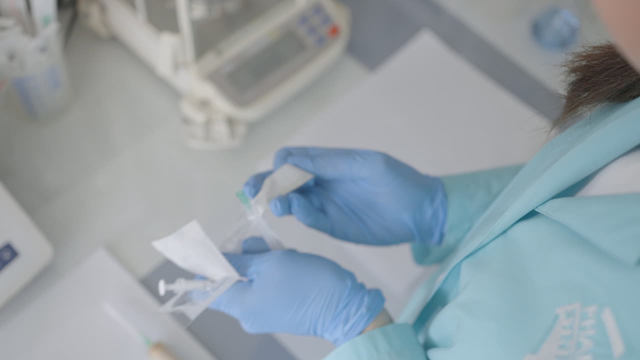 Lab technician preparing medical equipment