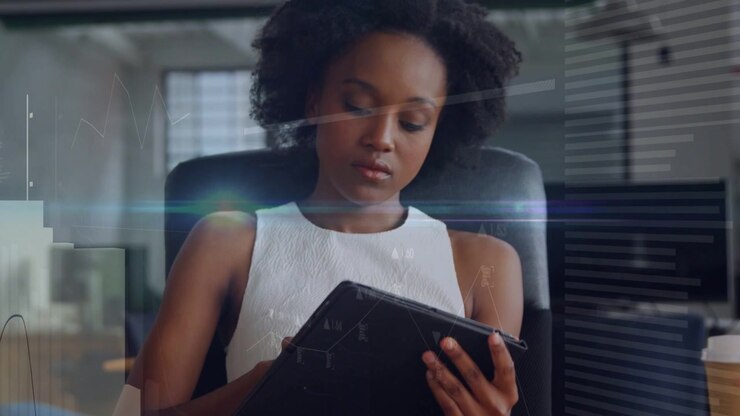 Woman tapping tablet on desk and scrolling, reviewing reports, spawning animated business charts