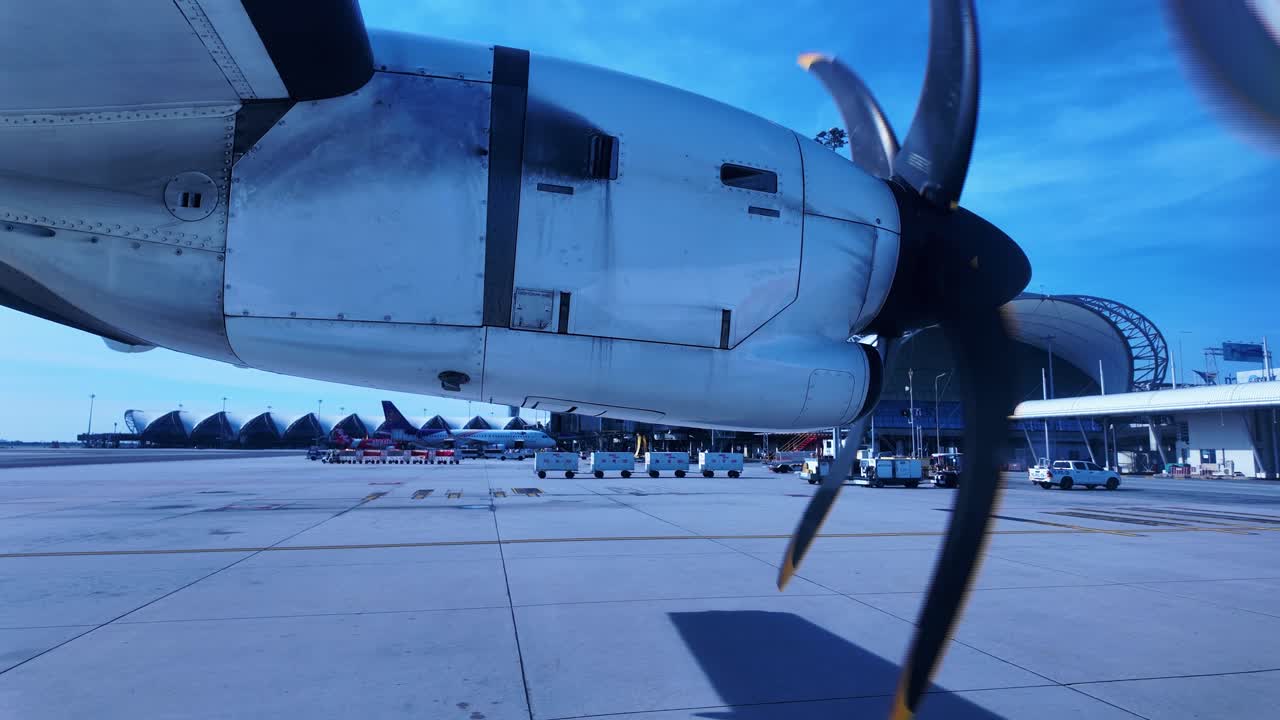 Bangkok Suvarnabhumi Airport BKK terminal airplane spin window view tarmac Thailand travel
