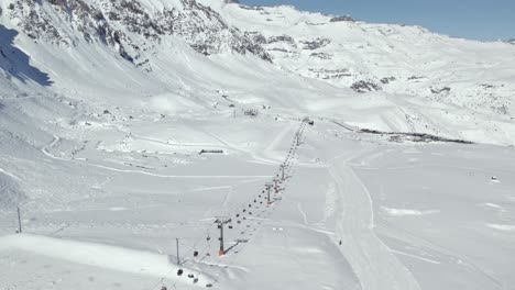 ski lift landscape mountains in farellones resort chile aerial drone shot across andean cordillera