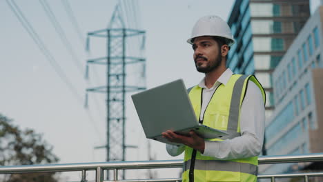 engineer working outdoors with laptop