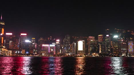 colorful lights illuminate hong kong's skyline at night