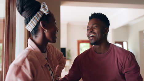Dance,-love-and-couple-in-home-laughing-together