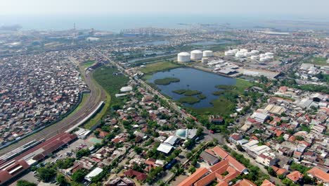 water pond and industrial area of semarang city surrounded with living districts, aerial view