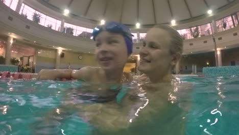 Happy-and-loving-mother-with-son-in-the-pool