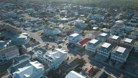 wide aerial over kure beach apartment properties establishing aerial view 4k