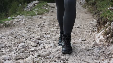 Active-young-woman-climbs-on-top-of-cliff