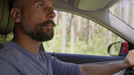 Close-up-video-of-man-driving-a-car