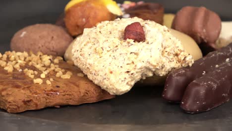 loopable selective focus view of delicious and freshly baked cookies on a plate in close up view.