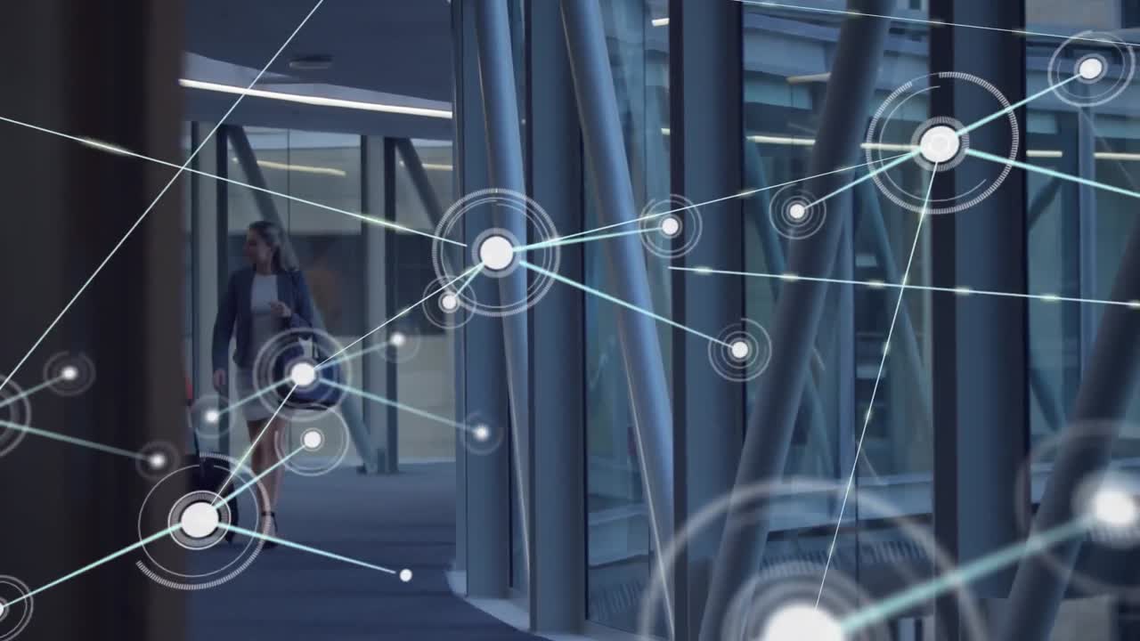 Animation of network of connection with icons over diverse businesswoman in office